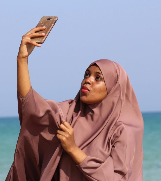 pexels-photo-1258727-1258727 Woman in hijab taking a selfie by the sea in Qandala, Somalia.